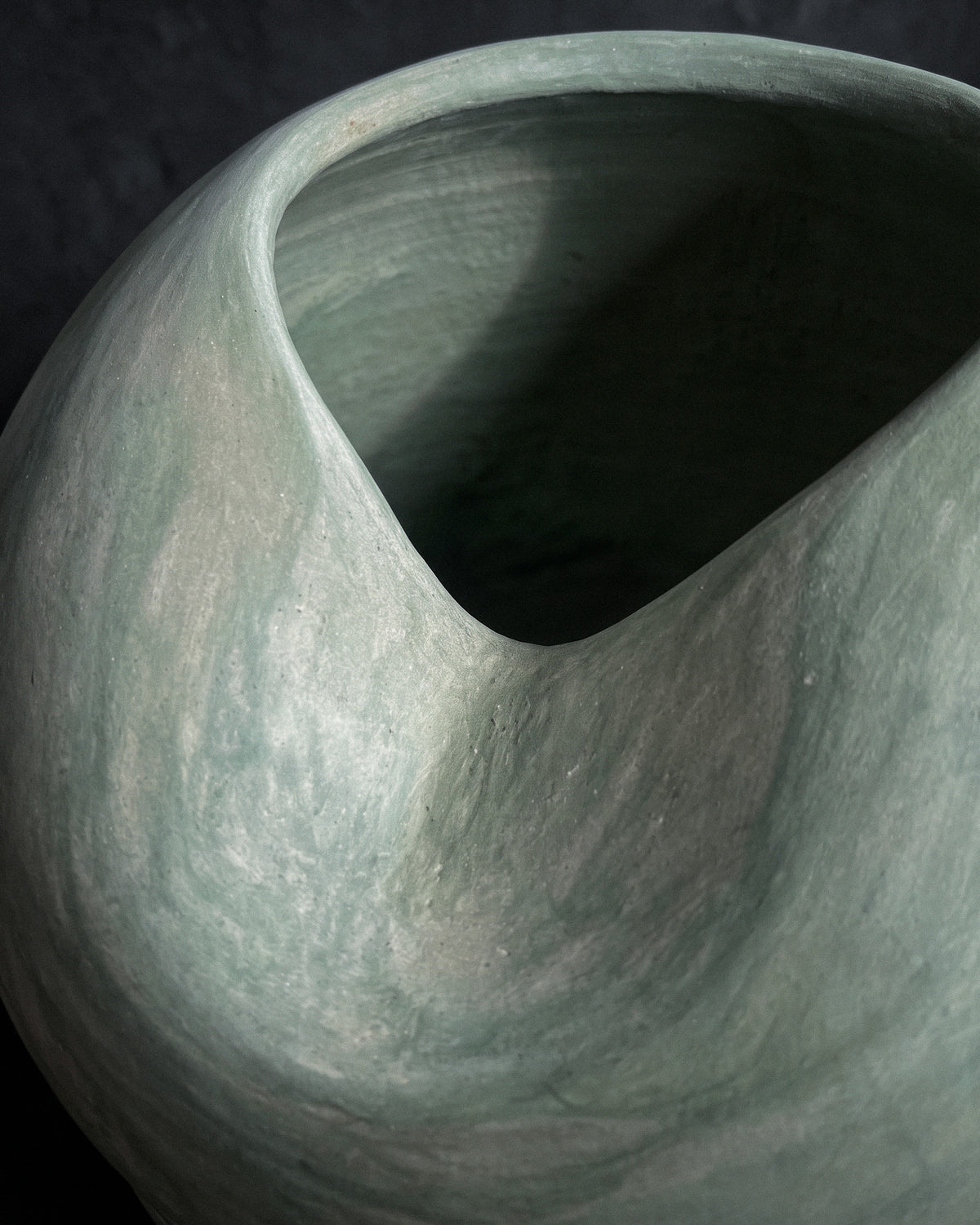 Detail of the hand-polished stone-like tadelakt lime plaster surface